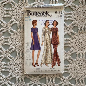 May include: Vintage sewing pattern for a dress and trousers. The pattern is for misses sizes 12-20. The pattern is from Butterick and is number 6437. The pattern is for a dress with a long sleeve and trousers with a wide leg.