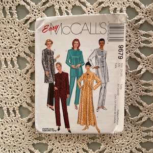 May include: A vintage McCall's sewing pattern, featuring illustrations of women's clothing designs. The pattern packet displays various outfits, including a long coat, pantsuit, and a long dress. The pattern number is 9679, and the size is XXL.