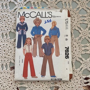 May include: McCall's sewing pattern number 7626, size 4, for pants. The pattern includes three different styles of pants, all with a wide leg. The pattern is printed on brown paper with a white background. The price is $1.75.