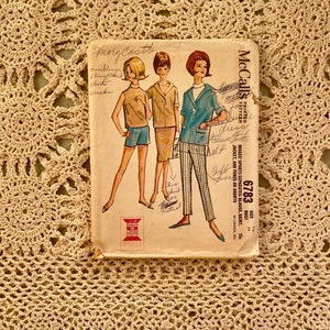 May include: Vintage McCall's sewing pattern for a women's outfit. The pattern is for a blouse, skirt, jacket, and pants or shorts. The pattern number is 6783 and the size is 14, 34, 75¢.