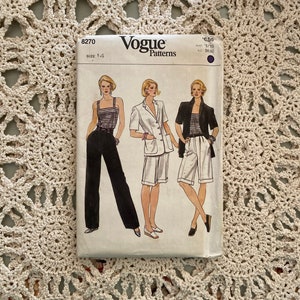May include: Vogue Patterns sewing pattern number 8270, size 14, featuring three women's outfits: a black and white striped tank top with black pants, a white button-up shirt with white shorts, and a black and white striped tank top with white shorts. The pattern is priced at $6.50.