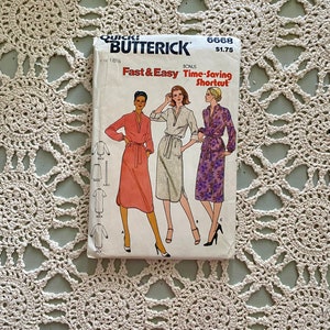 May include: A vintage sewing pattern for a dress with a tie waist. The pattern is from Butterick and is number 6668. The pattern is for sizes 18 1/2 and is titled "Fast & Easy Time-Saving Shortcut".