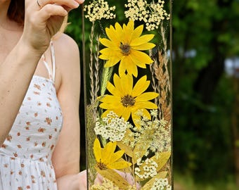 Pressed flower art in stained glass frame, dried wildflower bouquet with sunflower