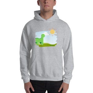May include: A gray hooded sweatshirt with a green dinosaur and a yellow sun on a blue and green background. The text "Hola El Sol" is printed on the sweatshirt.