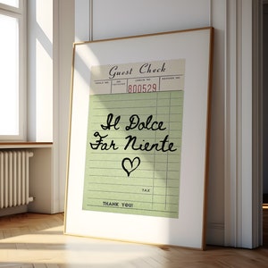 May include: A framed print of a vintage guest check with the text "Il Dolce Far Niente" written in cursive and a heart symbol. The check number is 800529.