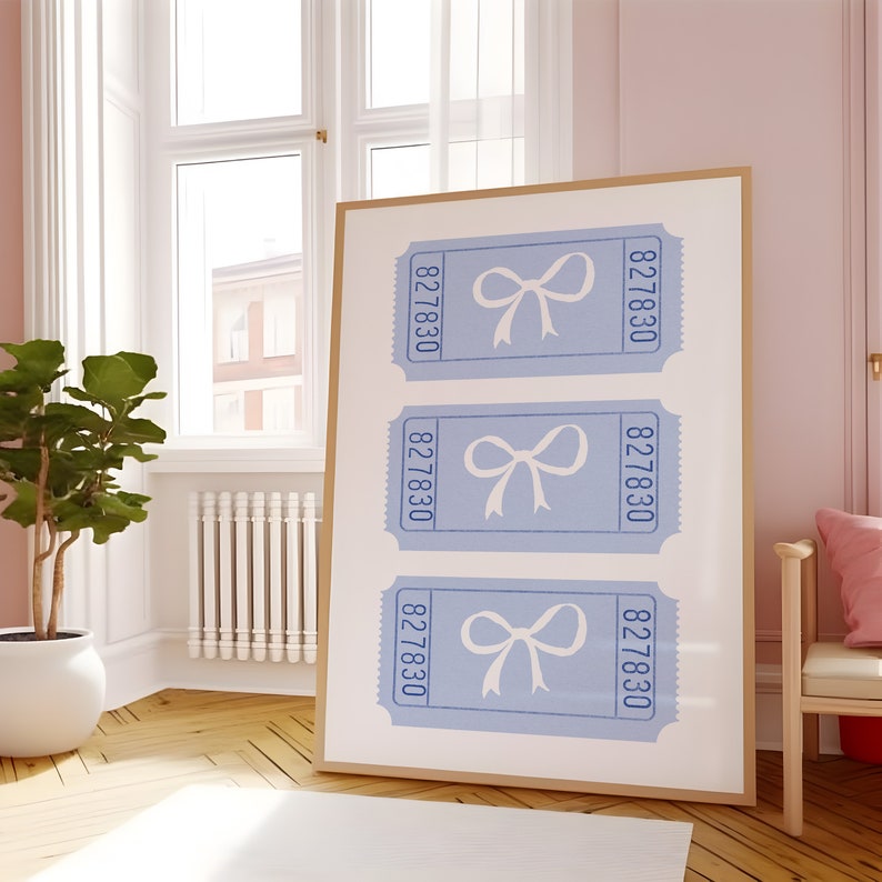 May include: A framed print with three blue tickets featuring white bows and the number 827830 on each ticket.