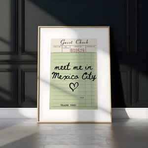 May include: A vintage-style guest check with the text "meet me in Mexico City" written in black ink with a heart drawn below. The check number is 1800529.