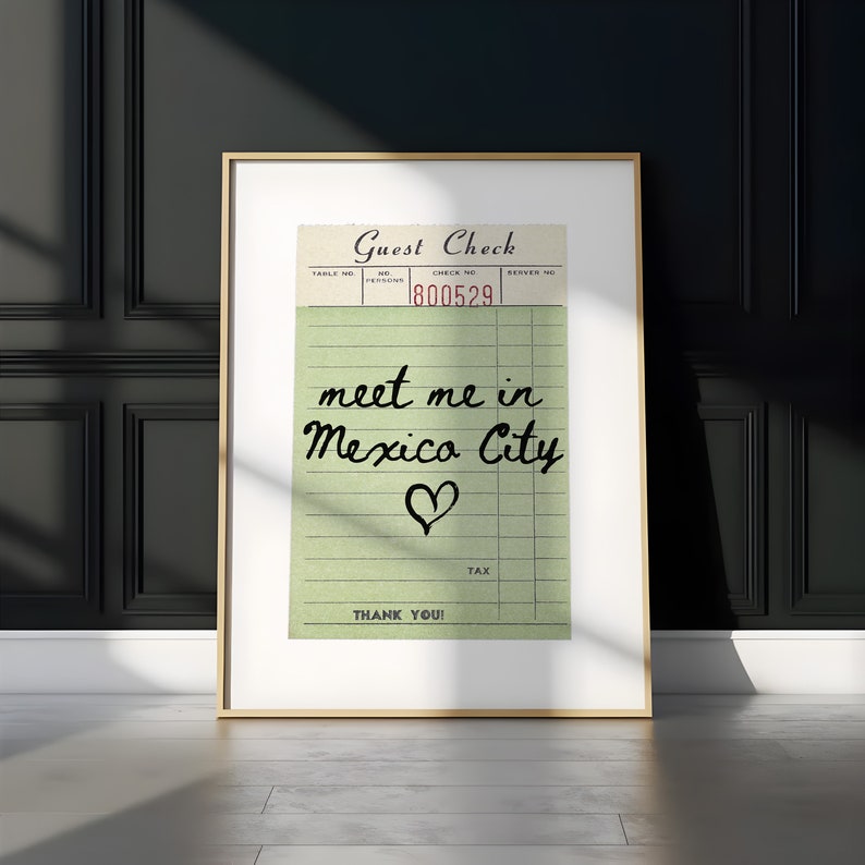 May include: A vintage-style guest check with the text "meet me in Mexico City" written in black ink with a heart drawn below. The check number is 1800529.