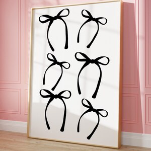 May include: A black and white print of six black bows with tails, arranged in a grid pattern on a white background.