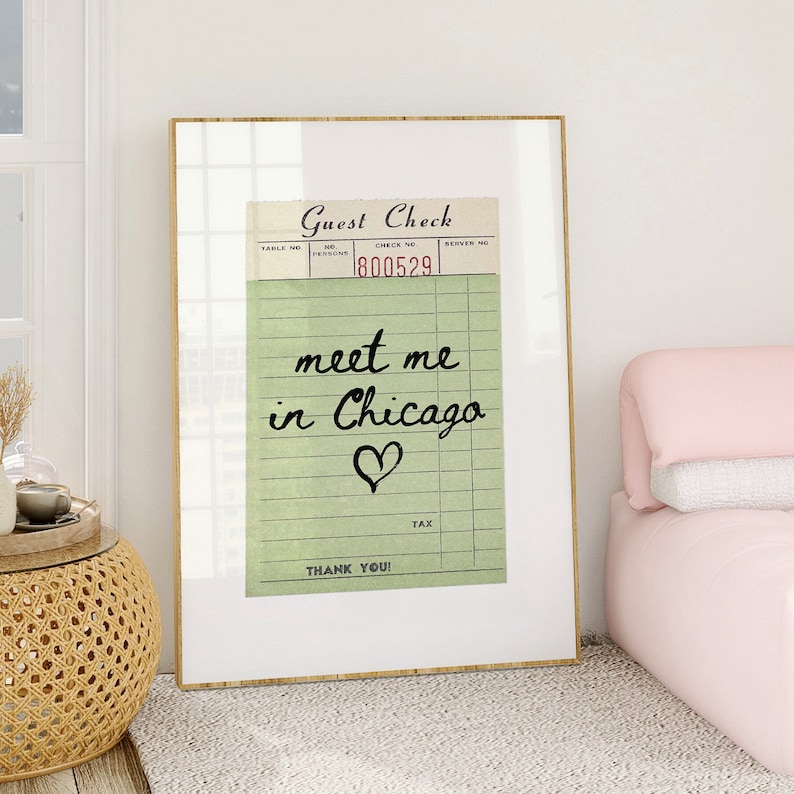 May include: A framed print of a vintage guest check with the text "meet me in Chicago" and a heart symbol. The check number is 800529.