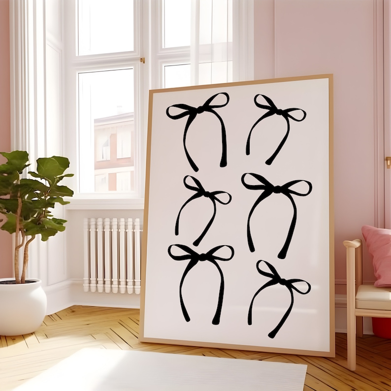 May include: A white canvas print with six black bow designs. The bows are arranged in a grid pattern.