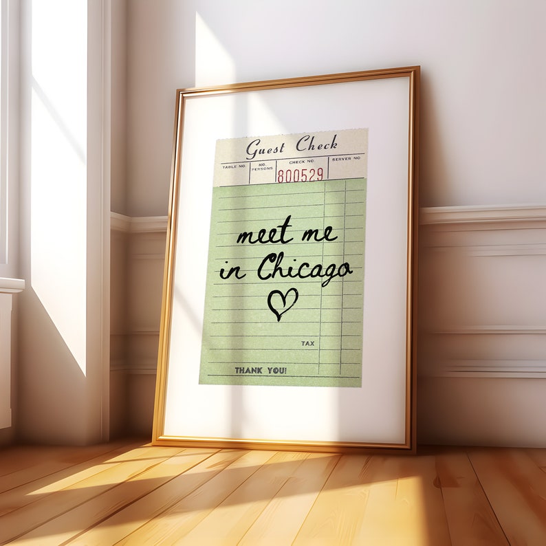 May include: A framed print of a vintage guest check with the text "meet me in Chicago" written in black cursive with a heart drawn below the text. The check number is 800529.