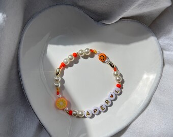 Perlenarmband Aperol Spritz mit goldener Schrift  (weiß/orange)