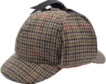 Stile elementare: il classico deerstalker di Sherlock Holmes nell'intramontabile pied de poule