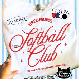 May include: White sweatshirt with the words "Tired Moms Softball Club" in red script. The design includes star accents and the phrase "Surviving on Snacks and Homeruns." The image also shows color options and the text "PNG & SVG."