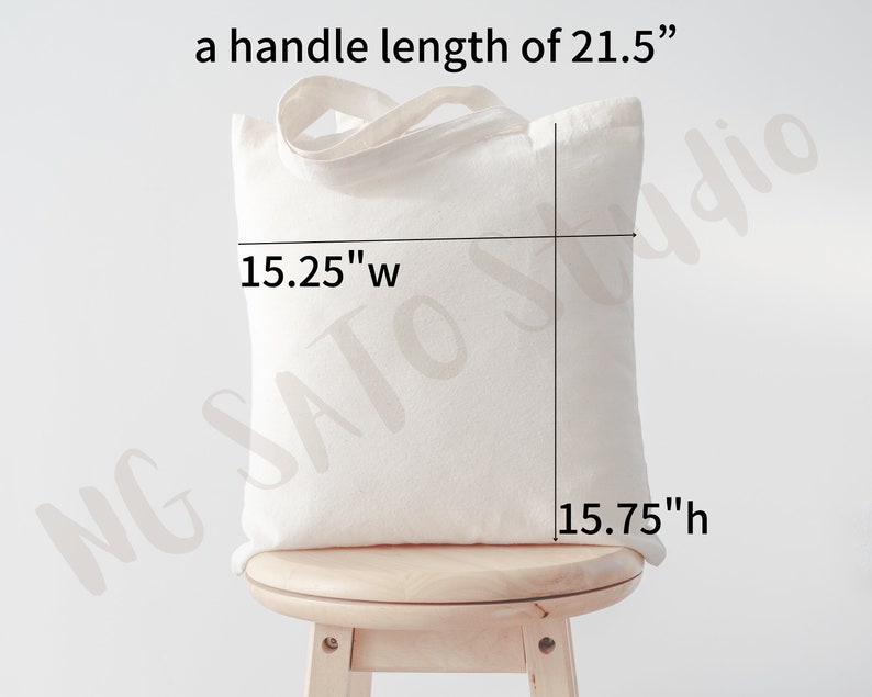 May include: A white canvas tote bag with a handle length of 21.5 inches. The bag measures 15.25 inches wide and 15.75 inches high.