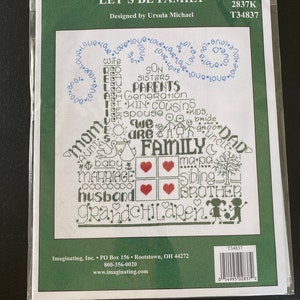 May include: A green and white cross-stitch pattern with the words "Let's Be Family" and a house-shaped design with words like "mom", "dad", "son", "daughter", "grandchild", "husband", "wife", "sister", "brother", "parents", "cousins", "baby", "marriage", "we are family" and "love" repeated in a circle around the house.