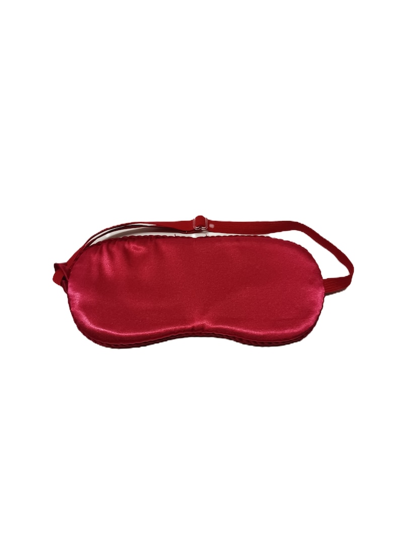 Red Satin Sleep Mask with an adjustable elastic strap.