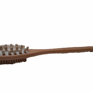 May include: A wooden body brush with a long handle and a rounded brush head with natural bristles. The brush head has a row of small, rounded knobs.