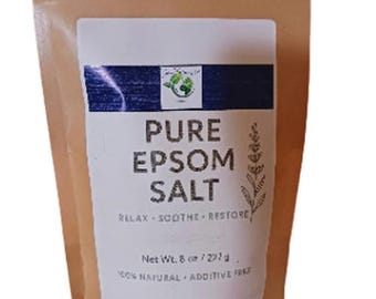 May include: A brown paper bag with a white label featuring the text "PURE EPSOM SALT." The label also includes the phrases "RELAX. SOOTHE. RESTORE." and "100% NATURAL + ADDITIVE FREE." The bag contains 8 oz / 227 g of product.