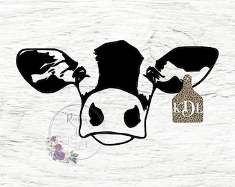 May include: A black and white cow head silhouette graphic featuring a leopard print ear tag with the white monogram letters KDL. The design includes a circular watermark with floral accents and the text Rockin D Vinyls in a script font.