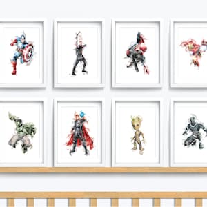 May include: Set of eight watercolour prints featuring various Marvel superheroes, including Captain America, Thor, Hulk, Iron Man, Black Panther, and Groot. The prints are framed in white and displayed on a white wall.
