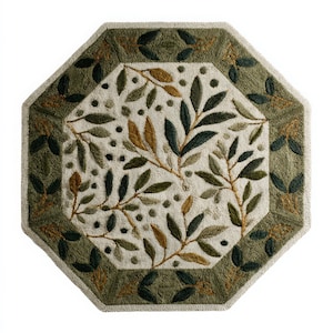 May include: An octagonal rug with a botanical design. The rug features a central cream-colored field with embroidered olive branches and leaves in shades of green and brown. A green border frames the design.