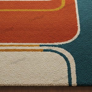 May include: Close-up of a textured rug with a retro design. The rug features a large orange shape, a teal blue section, and off-white and yellow accents. The rug has a thick, looped pile.