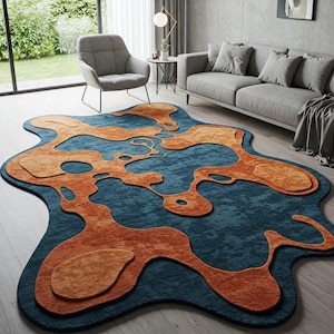 May include: Abstract area rug with a blue background and orange shapes. The rug has a unique, organic design and is made of soft, plush material.