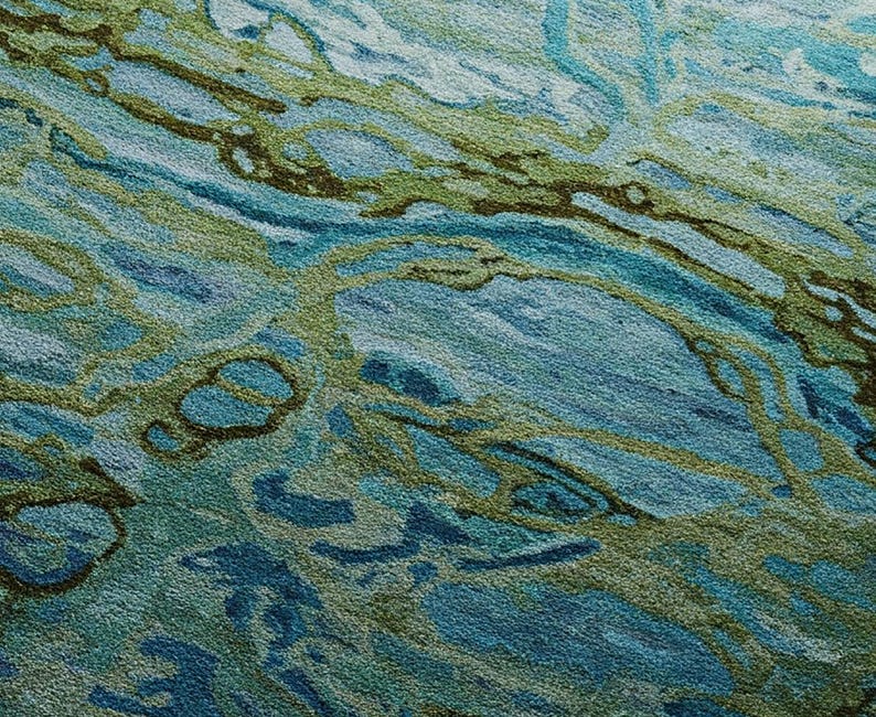 May include: Abstract rug with a swirling pattern of blue, green, and brown colors. The rug has a textured surface and a modern design.