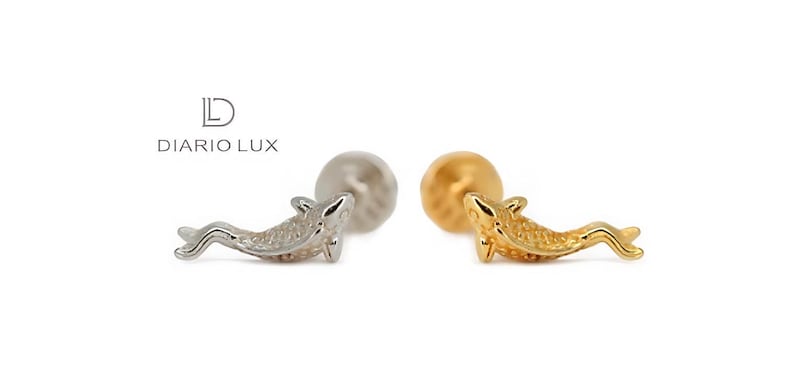 May include: Two gold and silver dolphin shaped earrings. The earrings are on a white background.