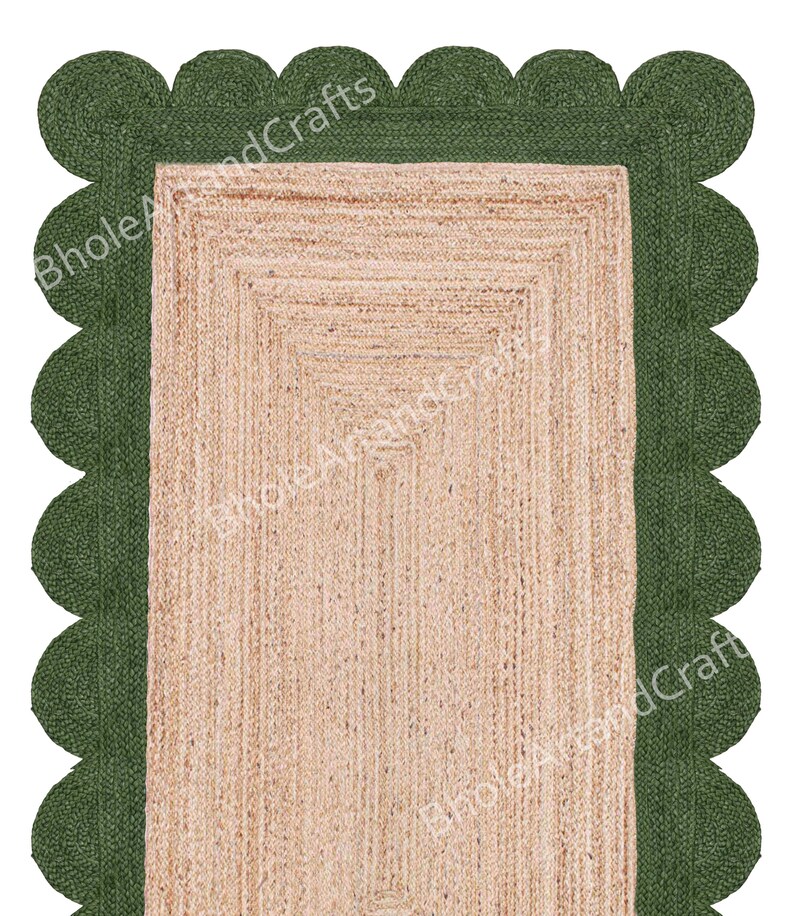 May include: A rectangular jute rug with a scalloped green border. The central area of the rug is a natural beige colour, and the green border adds a decorative touch. The rug is suitable for various home decor styles.