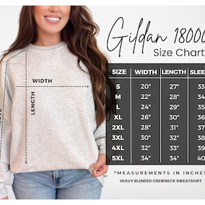 May include: Size chart for Gildan 18000 heavy blended crewneck sweatshirt. The chart shows measurements in inches for width, length, and sleeve length for sizes S through 5XL.