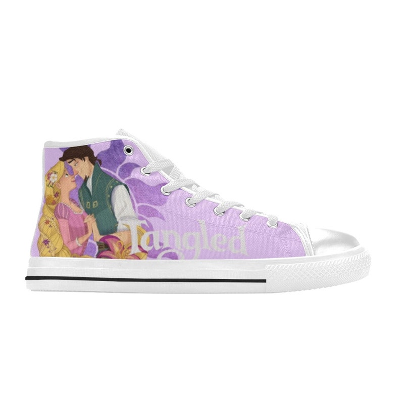 May include: White high-top canvas shoes with a purple background featuring a cartoon image of Rapunzel and Flynn Rider from the Disney movie Tangled. The word "Tangled" is printed in white on the side of the shoe.