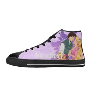 May include: Purple high-top canvas shoes with a black sole. The shoes feature a graphic of Rapunzel and Flynn Rider from the movie Tangled. The text "Tangled" is printed on the side of the shoes.