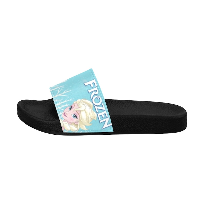 May include: Blue and white slide sandals with a picture of Elsa from Frozen and the word "FROZEN" on the strap.