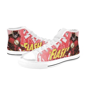 May include: White high-top canvas shoes with a red and yellow print featuring The Flash superhero. The print includes the words "The Flash" and lightning bolts.