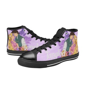 May include: Purple high-top canvas shoes with a black sole and black laces. The shoes feature a graphic of Rapunzel and Flynn Rider from the Disney movie Tangled. The text "Tangled" is printed on the side of the shoes.