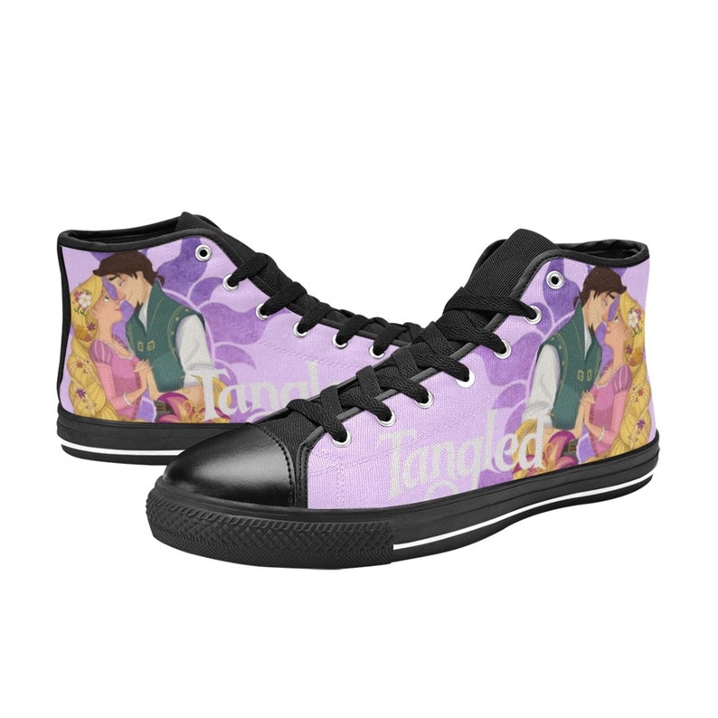 May include: Purple high-top canvas shoes with a black sole and black laces. The shoes feature a graphic of Rapunzel and Flynn Rider from the Disney movie Tangled. The text "Tangled" is printed on the side of the shoes.