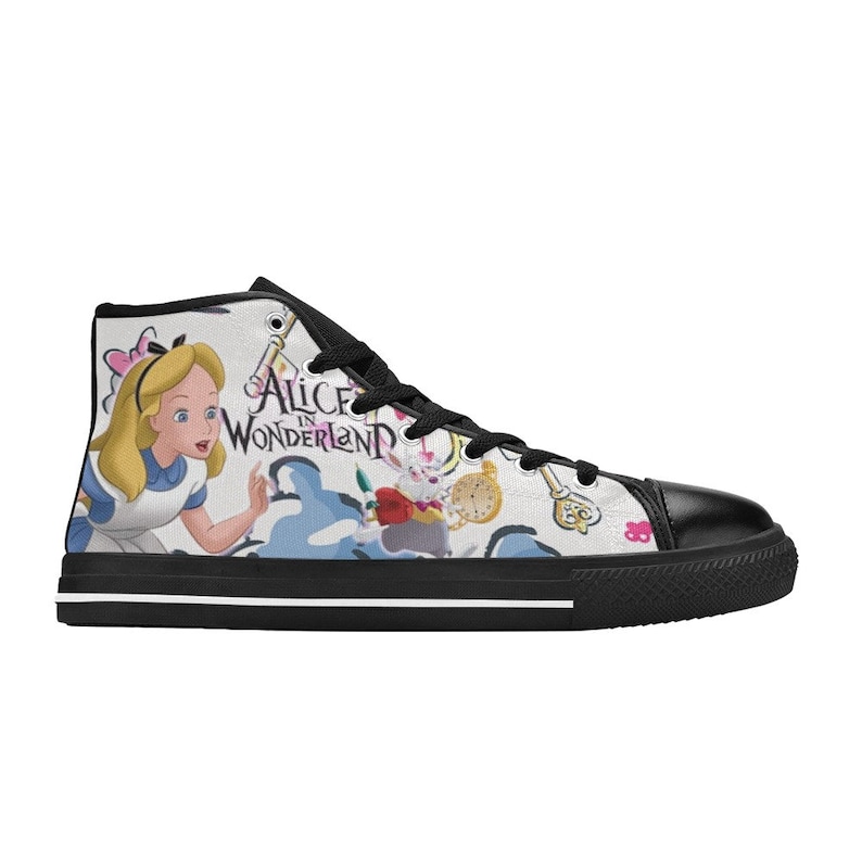 May include: White high-top canvas sneakers with a black sole. The sneakers feature a colorful print of Alice in Wonderland characters and the text "Alice in Wonderland".