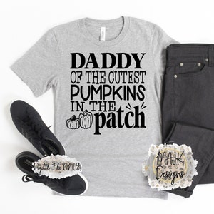 May include: Gray t-shirt with black text that reads "Daddy of the Cutest Pumpkins in the Patch" with a small graphic of three pumpkins.