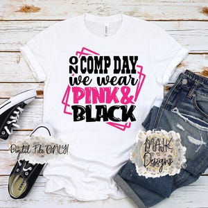 May include: White t-shirt with the text "COMP DAY we wear PINK & BLACK" in pink and black. The shirt is paired with blue jeans and black and white sneakers. The words "Digital File ONLY!" are also visible.