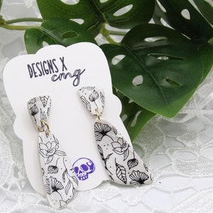 Handmade white and black floral printed polymer clay earrings, silkscreen shimmer clay jewelry, dangle drop earrings with flowers