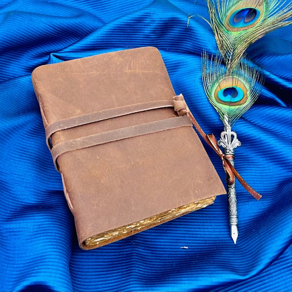Hand-bound leather journal with romantically rough deckle-edge pages — the kind of book that makes you want to write something worthy of it.
