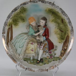 Raised Relief Lord & Lady Victorian attire decorative plate CIRCA 1960s image 1