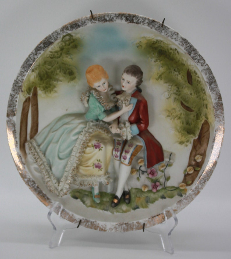 Raised Relief Lord & Lady Victorian attire decorative plate CIRCA 1960s image 1