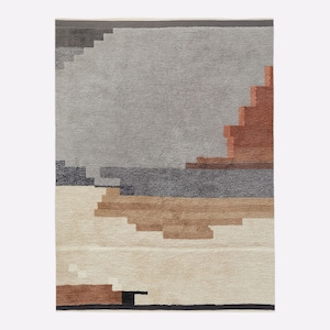 May include: A rectangular rug with a geometric design. The rug features a palette of grey, beige, brown, and rust. The design includes stepped shapes and horizontal bands, creating a textured, abstract landscape.