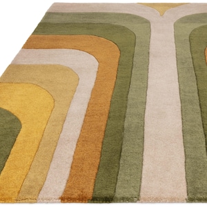 May include: A colorful area rug with a retro design. The rug features curved stripes in shades of green, gold, tan, and cream. The rug's pattern creates a sense of movement and adds a vibrant touch to any room.