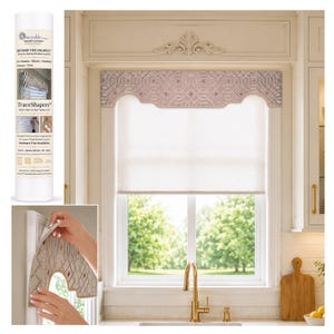 May include: A window valance featuring a geometric lattice pattern in shades of mauve and cream, installed over a white roller shade. The product packaging is a tall white tube labeled Traceable Designer TraceShapers for window accents.