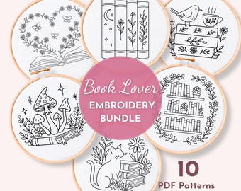 May include: A collection of six embroidery hoops with black and white line art designs. The designs include books, flowers, mushrooms, a cat, and a bird with a teacup. The text "Book Lover EMBROIDERY BUNDLE" is in a pink circle. The text "10 PDF Patterns" is also visible.